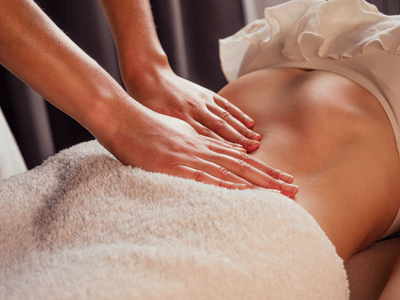 A client receiving a relaxing massage therapy session at a Vancouver clinic, with an RMT using precise techniques for pain relief